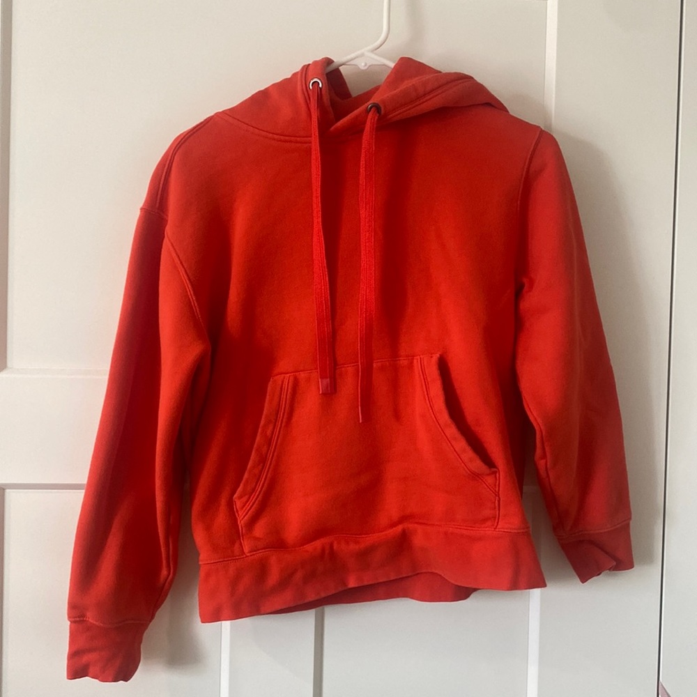 Bright red-orange hoodie from athleta.